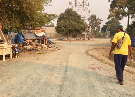 Supervisor Miley with surveying homeless encampment