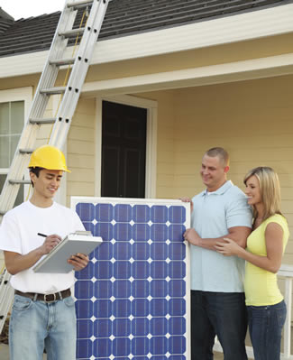 Photo of homeowners having a solar panel installed on their house.